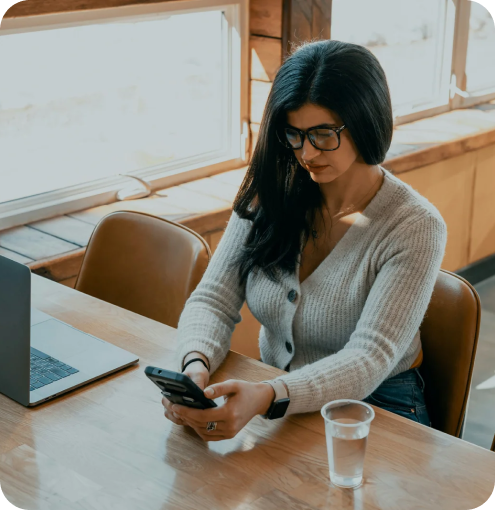 Woman using the Landlord-Tools app to manage tenant heat billing on the go